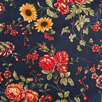 Bluebell floral quilting cotton fabric from the Daisy Lane collection by Kansas Troubles Quilters for Moda Fabrics featuring roses, daisies, and delicate blossoms on a deep blue background.