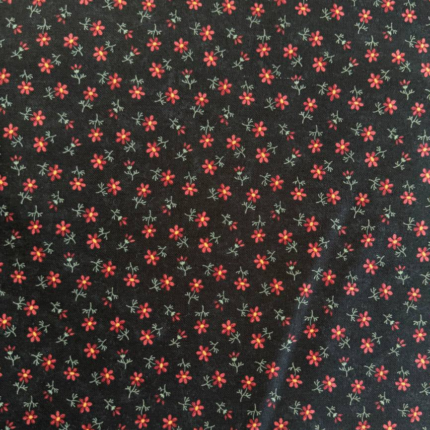 Small floral quilting cotton fabric from the Daisy Lane collection by Kansas Troubles Quilters for Moda Fabrics featuring scattered blossoms in Carnation and Mulch colorways.