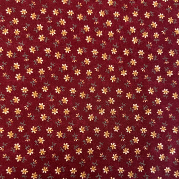 Small floral quilting cotton fabric from the Daisy Lane collection by Kansas Troubles Quilters for Moda Fabrics featuring scattered blossoms in Carnation and Mulch colorways.