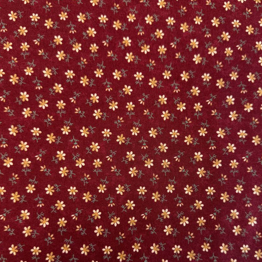 Small floral quilting cotton fabric from the Daisy Lane collection by Kansas Troubles Quilters for Moda Fabrics featuring scattered blossoms in Carnation and Mulch colorways.