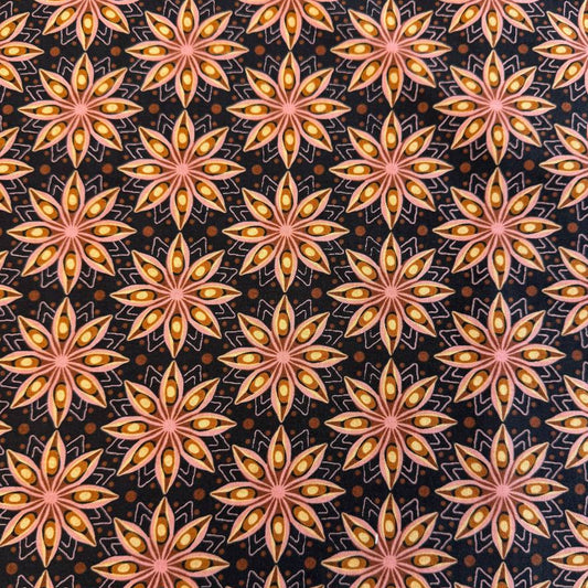 Acorn Hollow quilting cotton fabric by BasicGrey for Moda Fabrics featuring repeating geometric starburst motifs in pink, gold, and amber tones on a deep soil brown background.