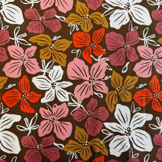 Large floral quilting cotton fabric from the Things Above collection by Fancy That Design House for Moda Fabrics featuring colorful hand-drawn flowers on Eggshell, Cocoa, and Water backgrounds.