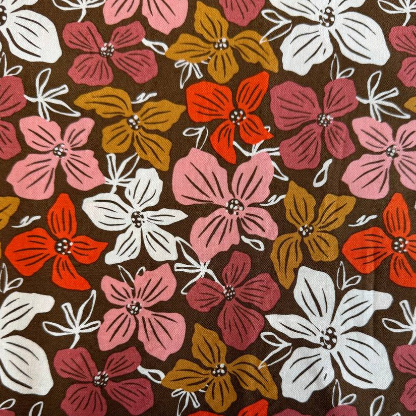 Large floral quilting cotton fabric from the Things Above collection by Fancy That Design House for Moda Fabrics featuring colorful hand-drawn flowers on Eggshell, Cocoa, and Water backgrounds.