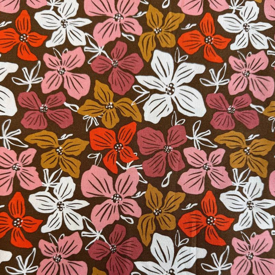 Large floral quilting cotton fabric from the Things Above collection by Fancy That Design House for Moda Fabrics featuring colorful hand-drawn flowers on Eggshell, Cocoa, and Water backgrounds.