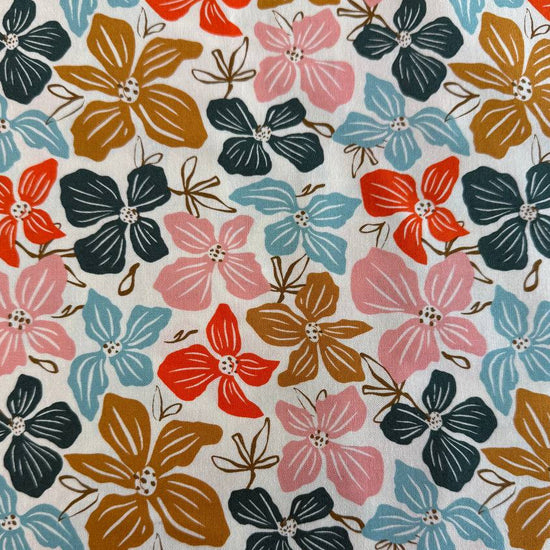 Large floral quilting cotton fabric from the Things Above collection by Fancy That Design House for Moda Fabrics featuring colorful hand-drawn flowers on Eggshell, Cocoa, and Water backgrounds.