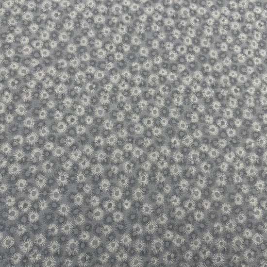 100% cotton tonal sunburst print fabric available in blue, sage green, charcoal grey and cream, 60 inches wide.