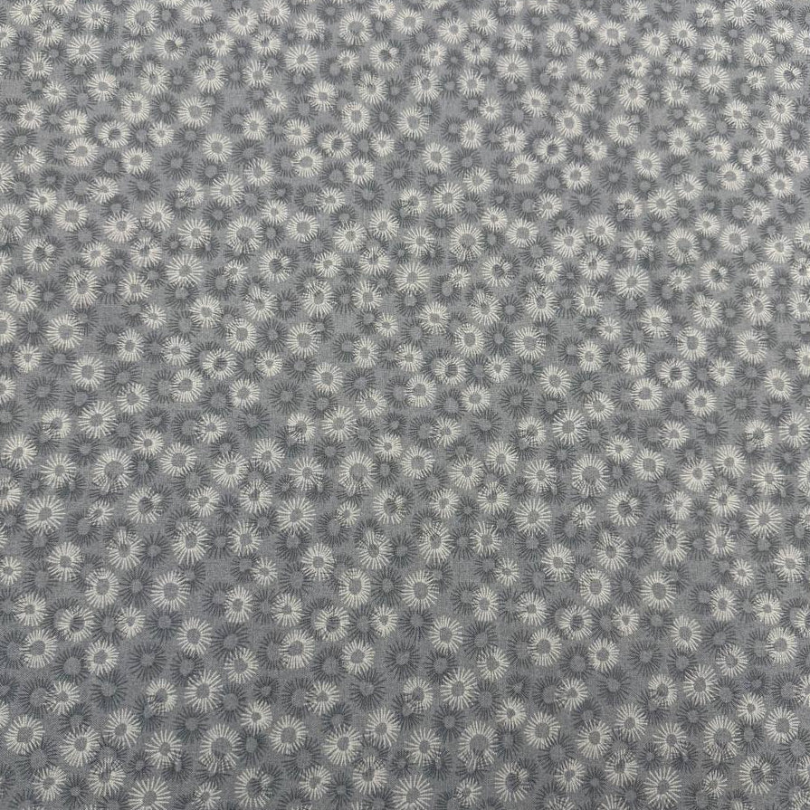 100% cotton tonal sunburst print fabric available in blue, sage green, charcoal grey and cream, 60 inches wide.