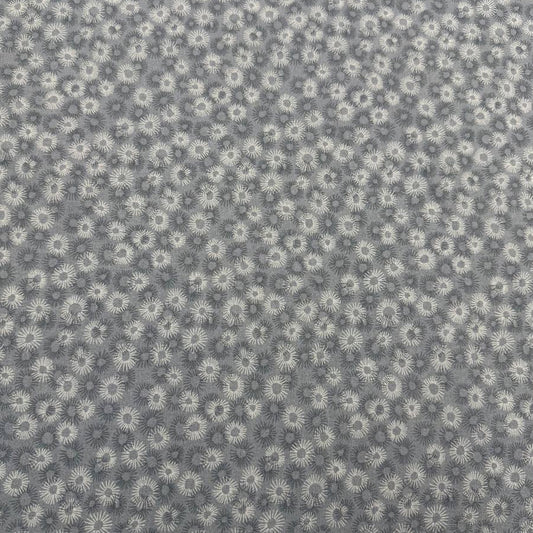 100% cotton tonal sunburst print fabric available in blue, sage green, charcoal grey and cream, 60 inches wide.