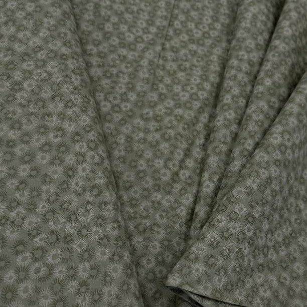 100% cotton tonal sunburst print fabric available in blue, sage green, charcoal grey and cream, 60 inches wide.