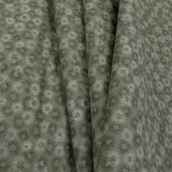 100% cotton tonal sunburst print fabric available in blue, sage green, charcoal grey and cream, 60 inches wide.