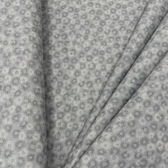 100% cotton tonal sunburst print fabric available in blue, sage green, charcoal grey and cream, 60 inches wide.