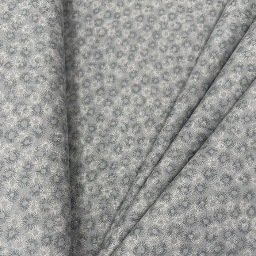 100% cotton tonal sunburst print fabric available in blue, sage green, charcoal grey and cream, 60 inches wide.