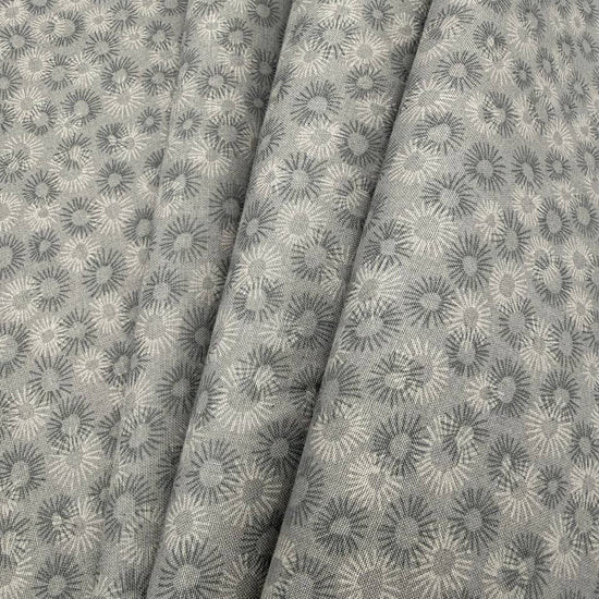 100% cotton tonal sunburst print fabric available in blue, sage green, charcoal grey and cream, 60 inches wide.