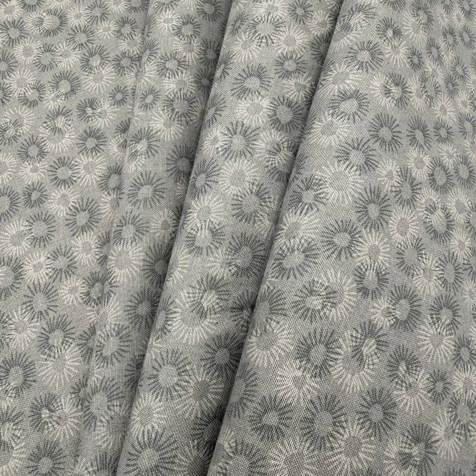 100% cotton tonal sunburst print fabric available in blue, sage green, charcoal grey and cream, 60 inches wide.