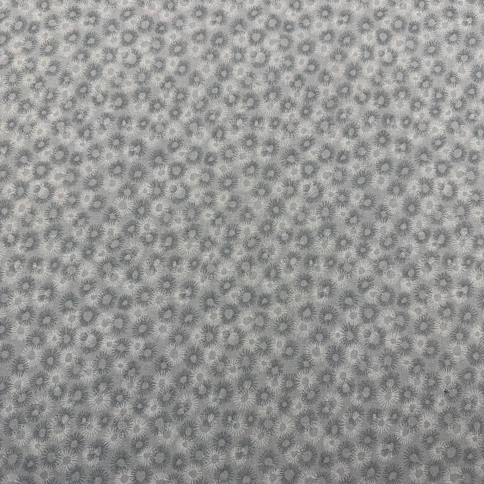 100% cotton tonal sunburst print fabric available in blue, sage green, charcoal grey and cream, 60 inches wide.