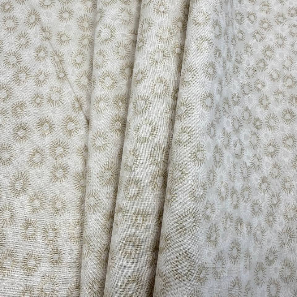 100% cotton tonal sunburst print fabric available in blue, sage green, charcoal grey and cream, 60 inches wide.