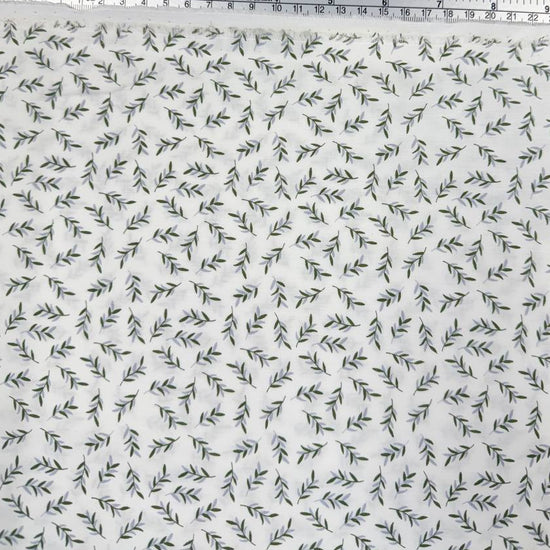 Ecru 100% cotton poplin fabric with delicate small green leaf print, 150 cm wide – Sasha’s Atelier.