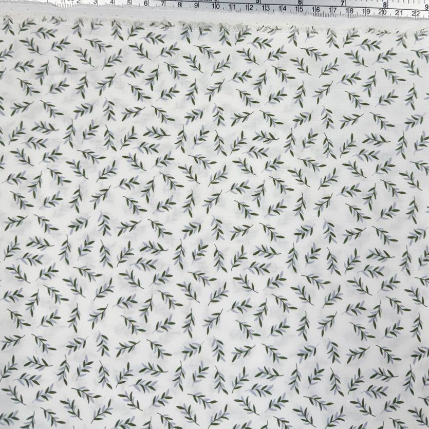 Ecru 100% cotton poplin fabric with delicate small green leaf print, 150 cm wide – Sasha’s Atelier.