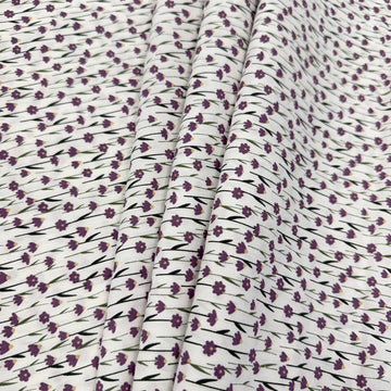 White 100% cotton poplin fabric with delicate purple cyclam flower print, 150 cm wide – Sasha’s Atelier.