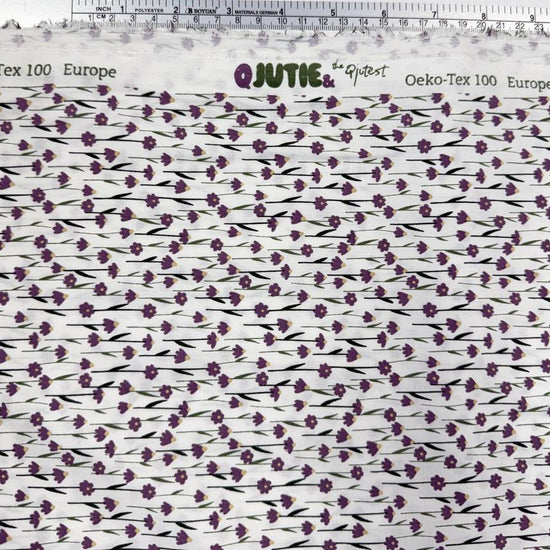 White 100% cotton poplin fabric with delicate purple cyclam flower print, 150 cm wide – Sasha’s Atelier.