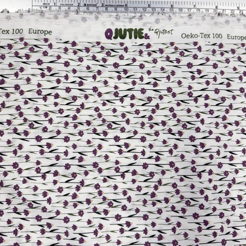 White 100% cotton poplin fabric with delicate purple cyclam flower print, 150 cm wide – Sasha’s Atelier.