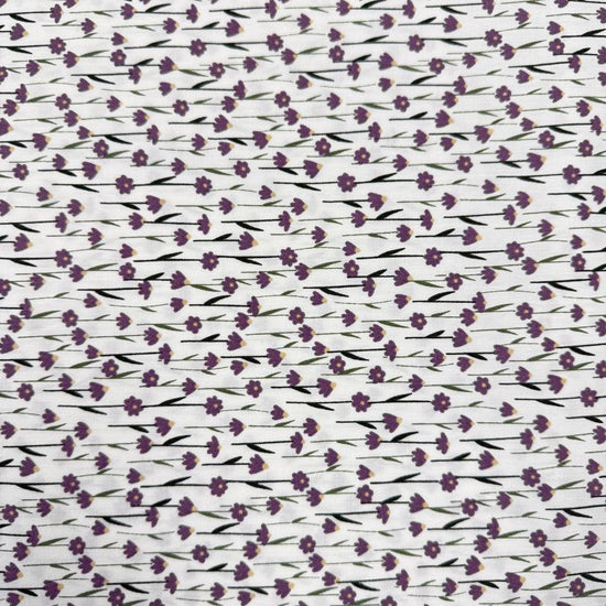 White 100% cotton poplin fabric with delicate purple cyclam flower print, 150 cm wide – Sasha’s Atelier.