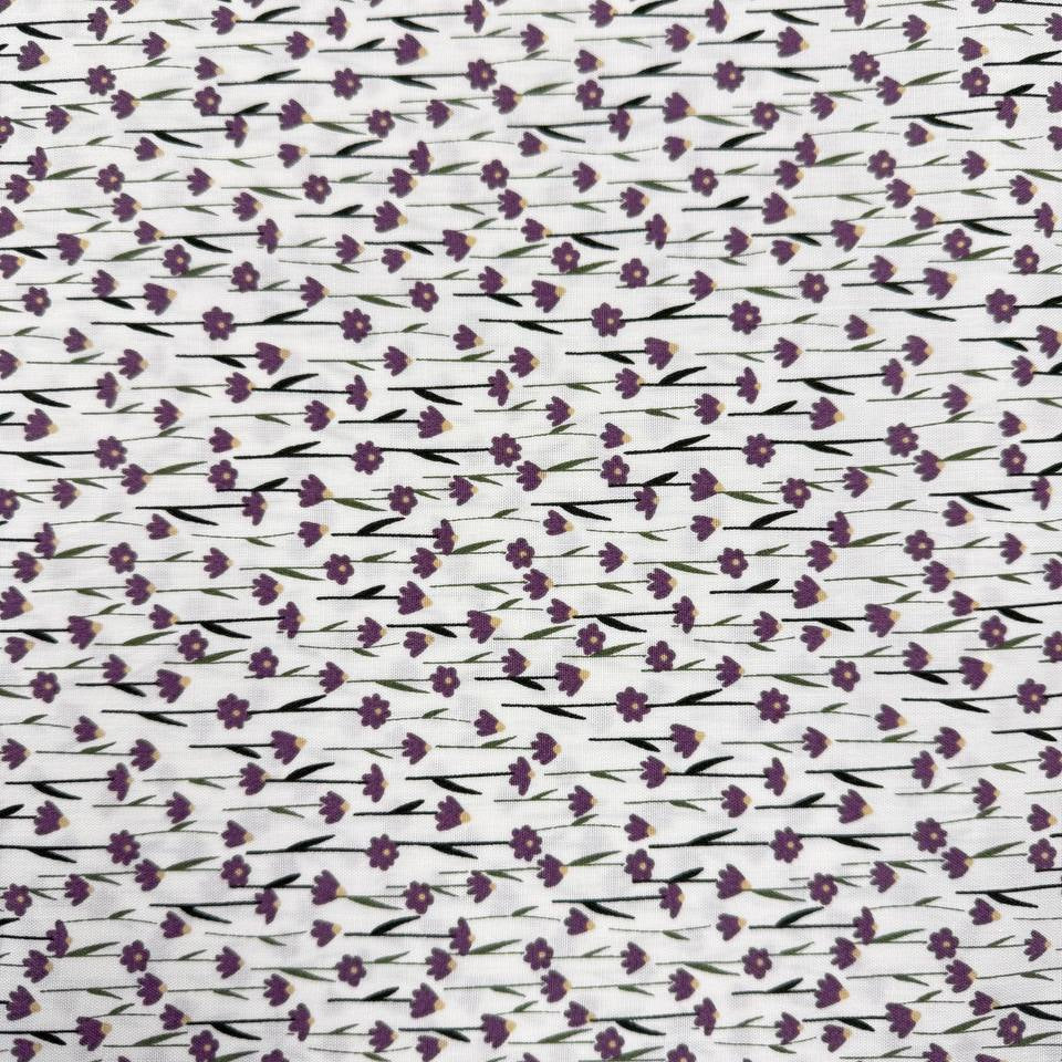White 100% cotton poplin fabric with delicate purple cyclam flower print, 150 cm wide – Sasha’s Atelier.