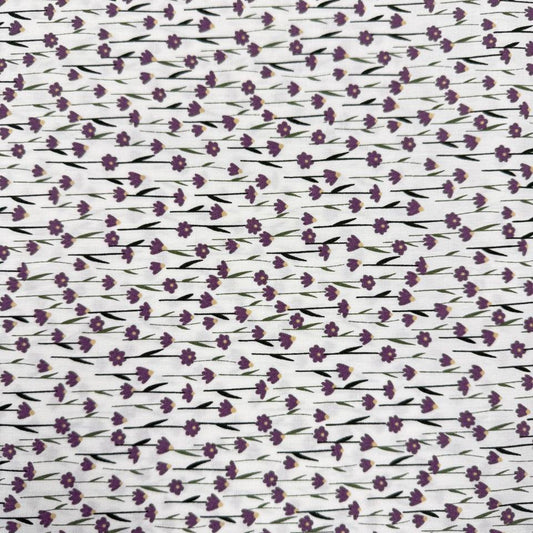 White 100% cotton poplin fabric with delicate purple cyclam flower print, 150 cm wide – Sasha’s Atelier.