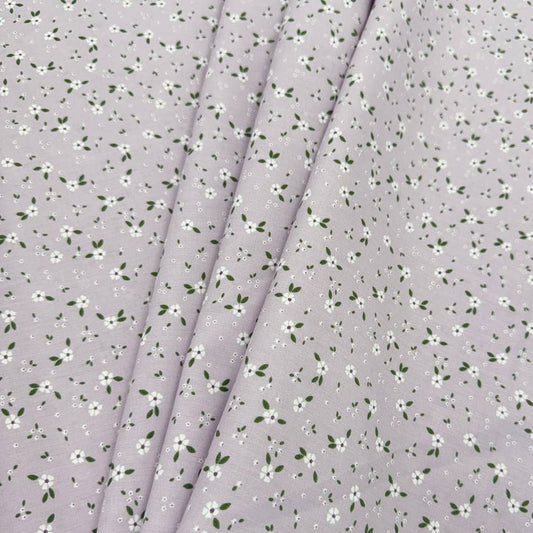 Lilac 100% cotton poplin fabric with delicate white floral print and green leaves, 150 cm wide – Sasha’s Atelier