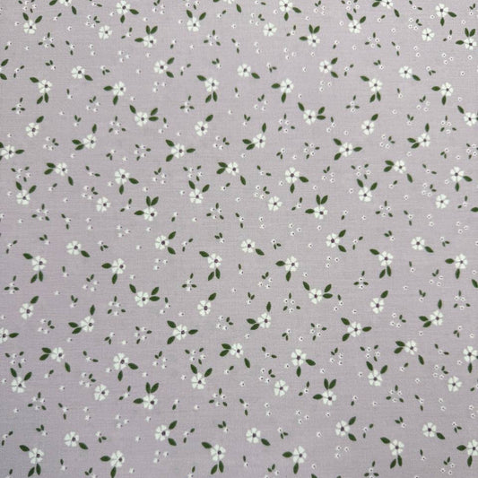 Lilac 100% cotton poplin fabric with delicate white floral print and green leaves, 150 cm wide – Sasha’s Atelier