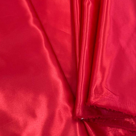 Alt text:
Satin De Luxe polyester fabric available in multiple colours including black, brown, off white, bottle green, poudre pink, antracite grey, optical white, red and navy.