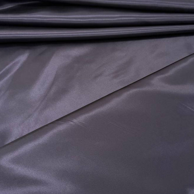 Alt text:
Satin De Luxe polyester fabric available in multiple colours including black, brown, off white, bottle green, poudre pink, antracite grey, optical white, red and navy.