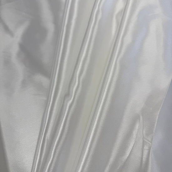Alt text:
Satin De Luxe polyester fabric available in multiple colours including black, brown, off white, bottle green, poudre pink, antracite grey, optical white, red and navy.