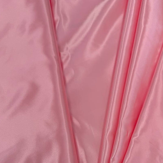 Alt text:
Satin De Luxe polyester fabric available in multiple colours including black, brown, off white, bottle green, poudre pink, antracite grey, optical white, red and navy.