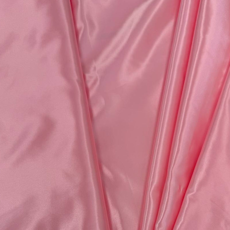 Alt text:
Satin De Luxe polyester fabric available in multiple colours including black, brown, off white, bottle green, poudre pink, antracite grey, optical white, red and navy.