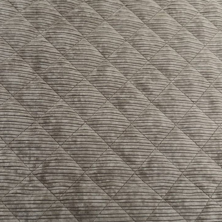 Quilted ribbed corduroy fabric with soft plush backing available in Champagne, Brown, Khaki, Taupe and Sand