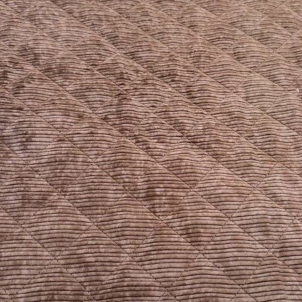 Quilted ribbed corduroy fabric with soft plush backing available in Champagne, Brown, Khaki, Taupe and Sand