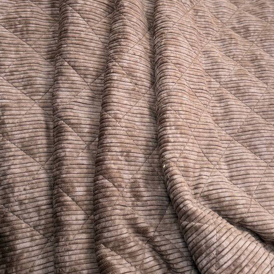 Quilted ribbed corduroy fabric with soft plush backing available in Champagne, Brown, Khaki, Taupe and Sand