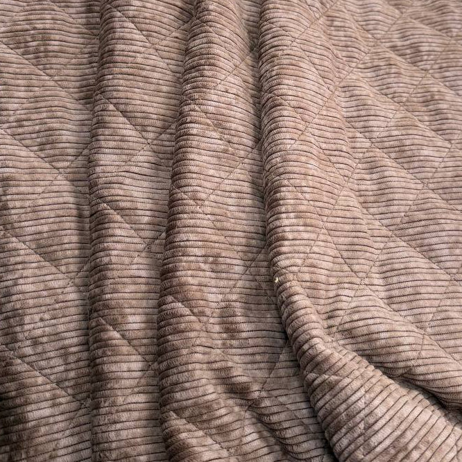 Quilted ribbed corduroy fabric with soft plush backing available in Champagne, Brown, Khaki, Taupe and Sand
