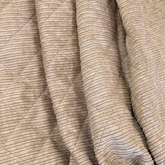Quilted ribbed corduroy fabric with soft plush backing available in Champagne, Brown, Khaki, Taupe and Sand