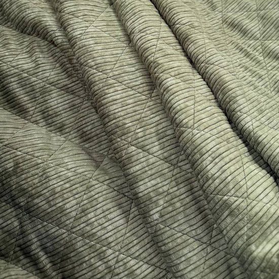 Quilted ribbed corduroy fabric with soft plush backing available in Champagne, Brown, Khaki, Taupe and Sand