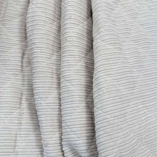 Quilted ribbed corduroy fabric with soft plush backing available in Champagne, Brown, Khaki, Taupe and Sand
