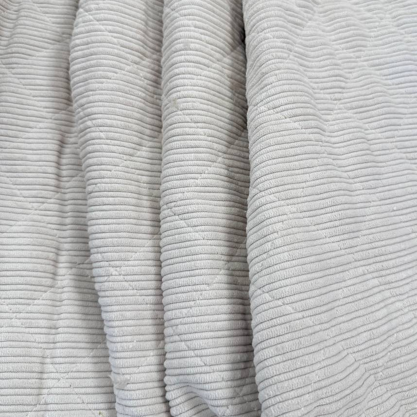 Quilted ribbed corduroy fabric with soft plush backing available in Champagne, Brown, Khaki, Taupe and Sand