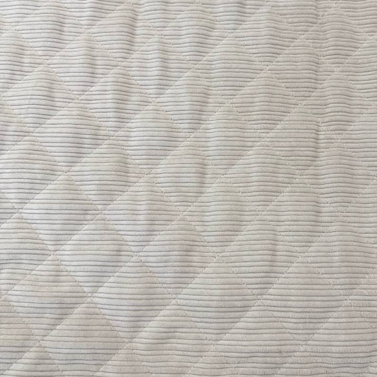 Quilted ribbed corduroy fabric with soft plush backing available in Champagne, Brown, Khaki, Taupe and Sand