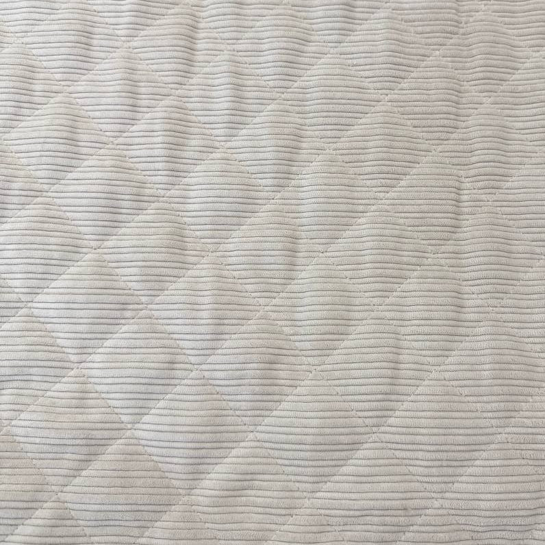 Quilted ribbed corduroy fabric with soft plush backing available in Champagne, Brown, Khaki, Taupe and Sand