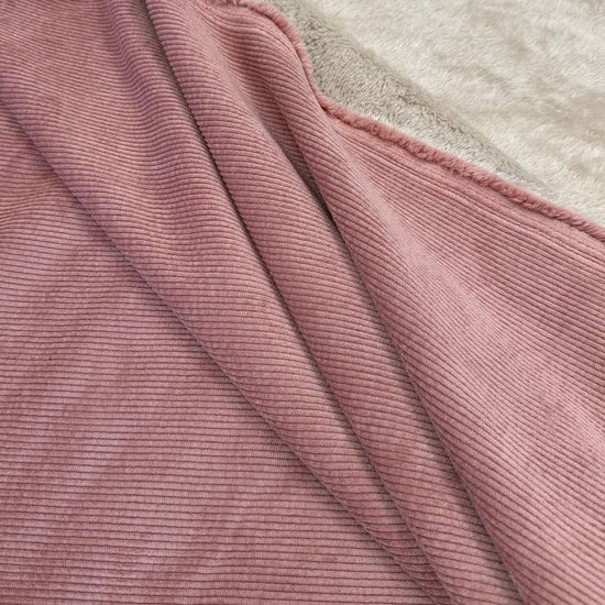 Washed corduroy bonded sherpa fabric in Camel Taupe and Old Rose with soft plush backing