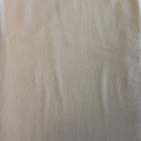 Flannel Snuggle MK Solid Beige flannel fabric, 100% cotton, soft neutral beige flannel perfect for quilts, nursery projects, and cozy apparel.