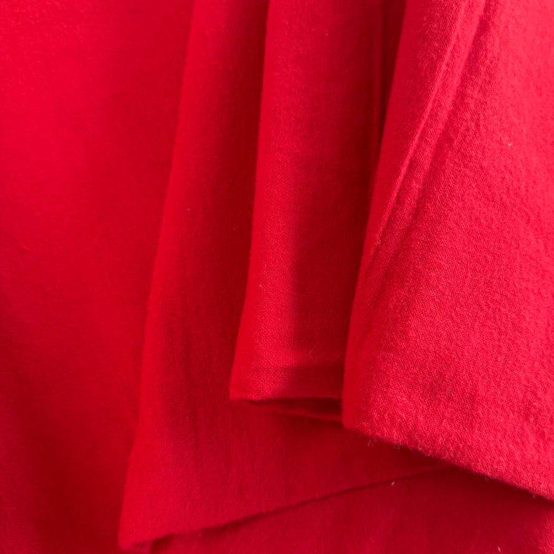 Flannel Snuggle MK Solid Red flannel fabric, 100% cotton, soft solid red flannel for quilting, blankets, pajamas, and sewing projects.