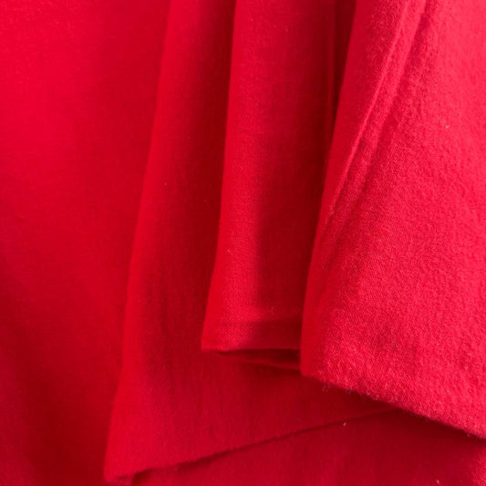 Flannel Snuggle MK Solid Red flannel fabric, 100% cotton, soft solid red flannel for quilting, blankets, pajamas, and sewing projects.