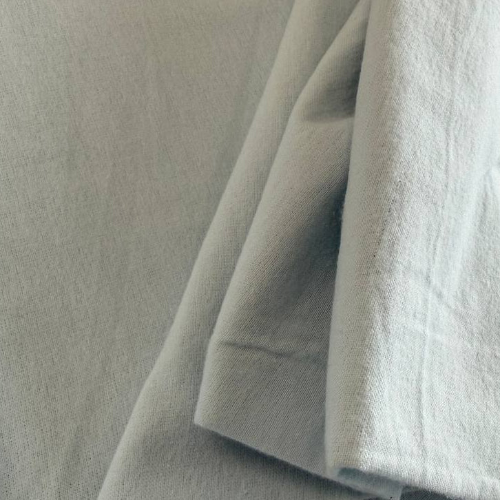 Flannel Snuggle MK Solid Light Blue flannel fabric, 100% cotton, soft solid light blue flannel ideal for quilting, baby blankets, pajamas, and crafts.